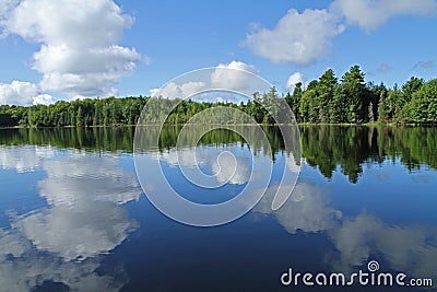 Puffy Clouds Reflected in Lake