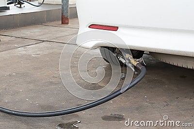 Pumping gas at gas pump
