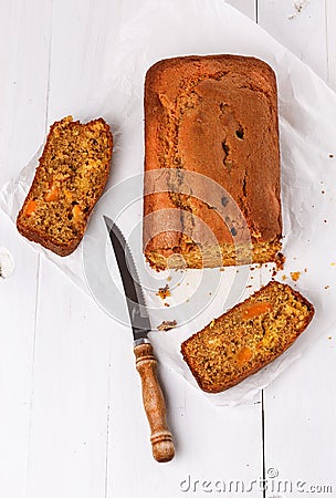 Pumpkin bread loaf over white wooden background