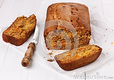 Pumpkin bread loaf over white wooden background