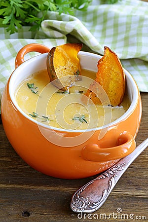 Pumpkin cream soup with pieces roasted pumpkin