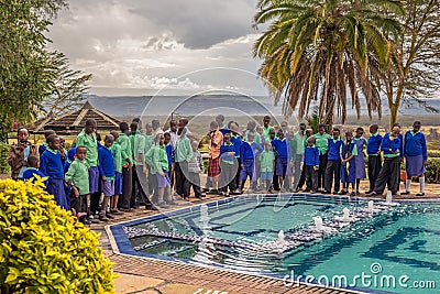 Pupils lined up in blue school uniforms near lake Nakuru, Kenya