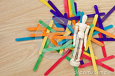 Puppet and colored wood sticks