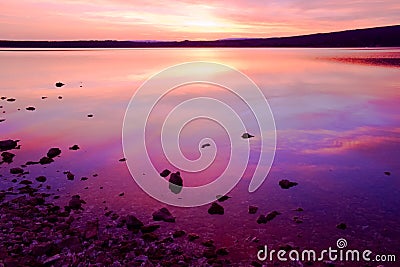 Purple sunset over sea water
