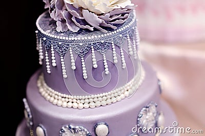 Purple wedding cake decorated with flowers