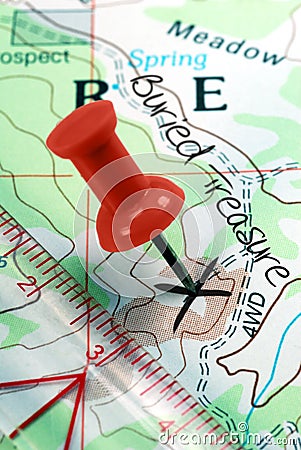 Push Pin on Topographical Treasure Map
