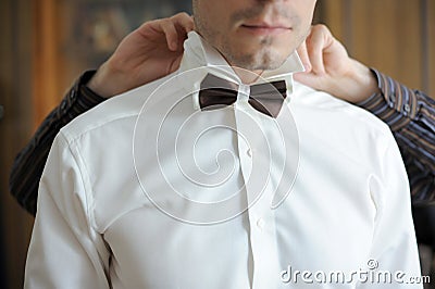 Putting on Bow Tie