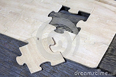 Puzzle on wooden boards team business concept