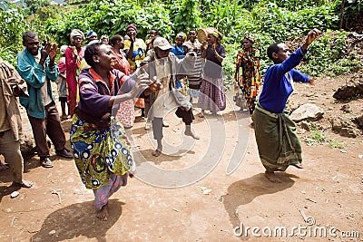 Pygmy people sing and dance in their village.