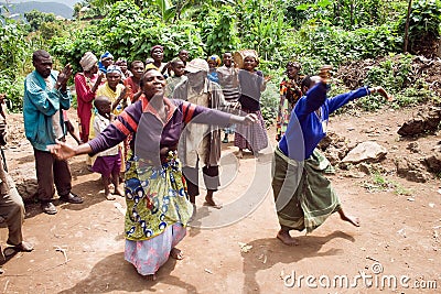 Pygmy people sing and dance in their village.