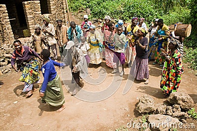 Pygmy people sing and dance in their village.