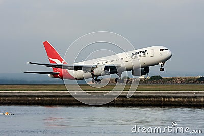 Qantas Boeing 767 jet airliner taking off.