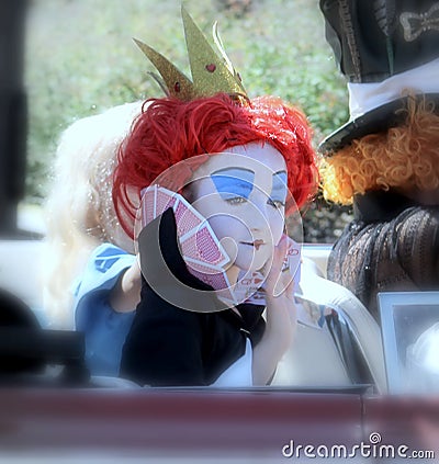 Child in Queen of hearts costume in parade