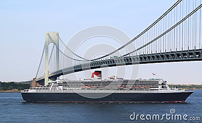 Queen Mary 2 cruise ship in New York Harbor under Verrazano Bridge heading for Canada New England