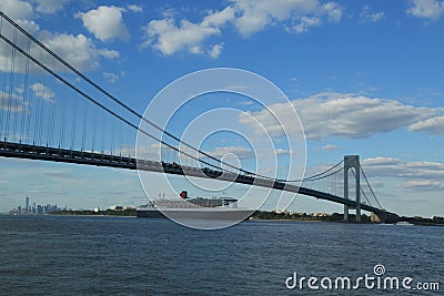 Queen Mary 2 cruise ship in New York Harbor under Verrazano Bridge heading for Transatlantic Crossing from New York to Southampton