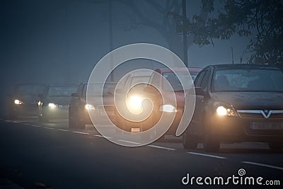 Queue of cars in fog