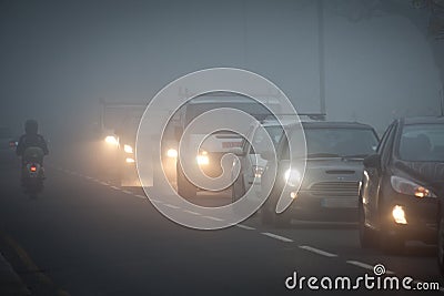 Queue of cars in fog