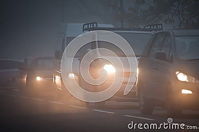 Queue of cars in fog