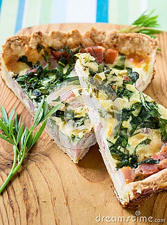 Quiche lorraine, pie with a smoked bacon, cheese and spinach