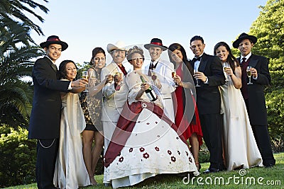 Quinceanera Standing With Family And Friends