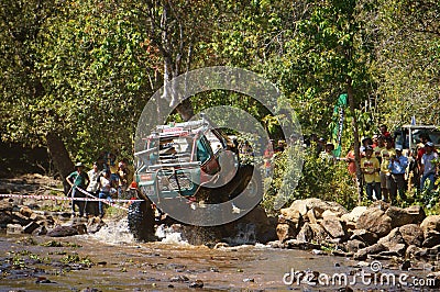 Racer off road at terrain racing car competition