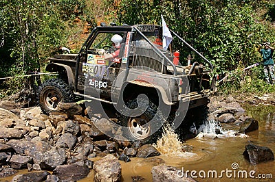 Racer off road at terrain racing car competition