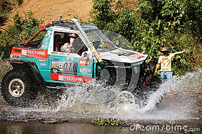 Racer off road at terrain racing car competition