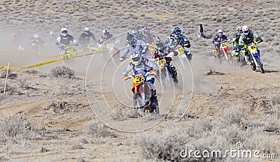 Racers Corning on Dirt Bikes