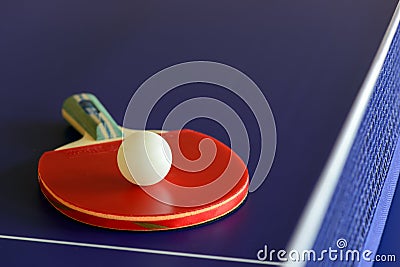 Racket and ball on table- tennis table