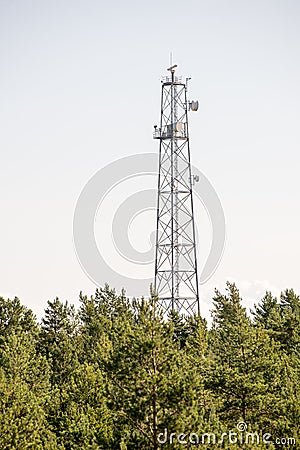 Radio antenna on beach skyline with sand and perspective