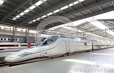 Railway station platform with a high-speed train