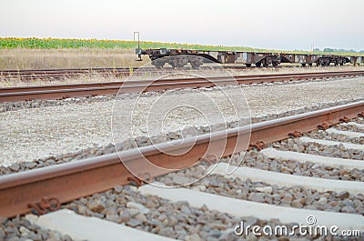 Railway Tracks with Empty Open Wagons Sidewards