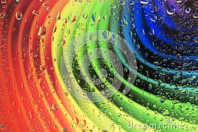 Rainbow consists of cardboard and raindrops on glass