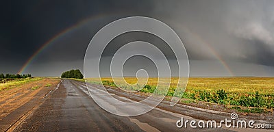 Rainbow over road