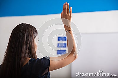 Raising a hand in class