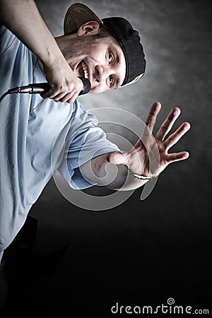 Rap singer man with microphone cool hand gesture