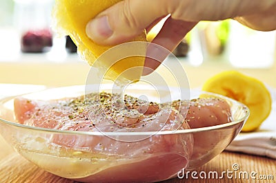 Raw chicken breasts marinating