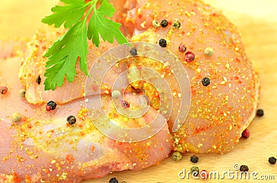 Raw chicken meat on cutting board