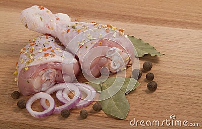 Raw chicken meat with herbs, onions and peppers