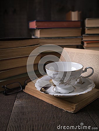 Reading with Old Books and Tea Cup