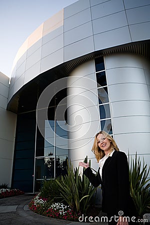 Real Estate Agent on Attractive Blond Business Woman Wearing Professional Business Suit