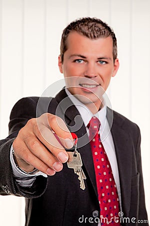 Real estate broker with a house key