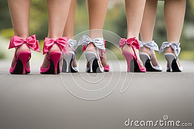 Rear view of a group ladies wearing colourful bow high heels