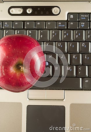 Red apple with computer
