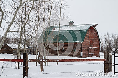 Red barn with a green tin roof