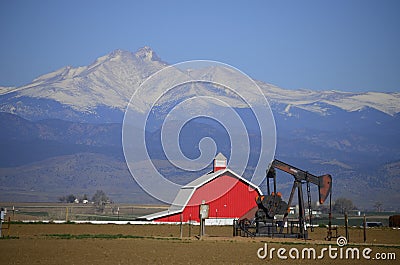 Red Barn Pump Jack Oil well and Longs Peak