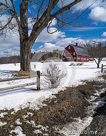 New England farm in winter with red barn