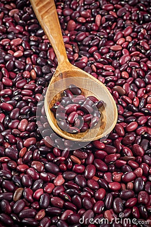 Red beans in wooden spoon texture