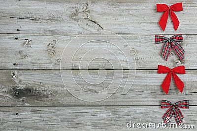 Red bows bordering wood sign