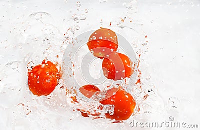 Red cherry tomatoes with water splash